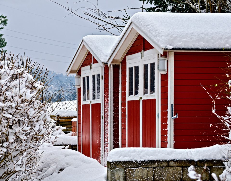 Two beautiful storage sheds in the snow